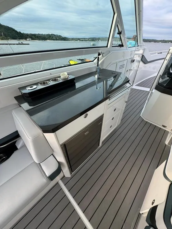 Slide: The Image of 2020 Formula 400 Super Sport Crossover interior with sleek kitchenette and modern design. - 17