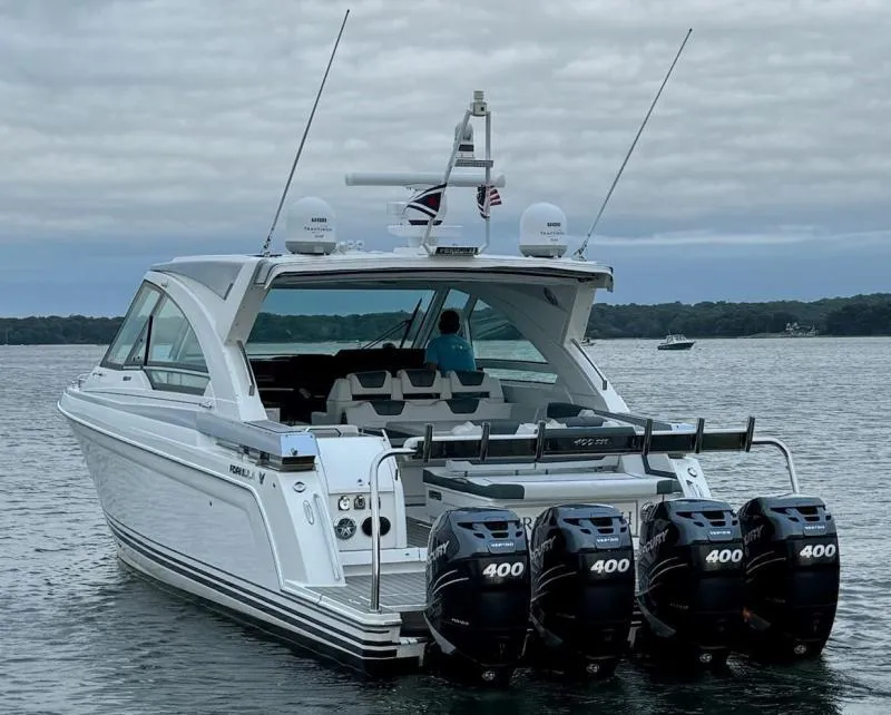 Slide: The Image of 2020 Formula 400 Super Sport Crossover boat with four powerful outboard engines on water. - 7
