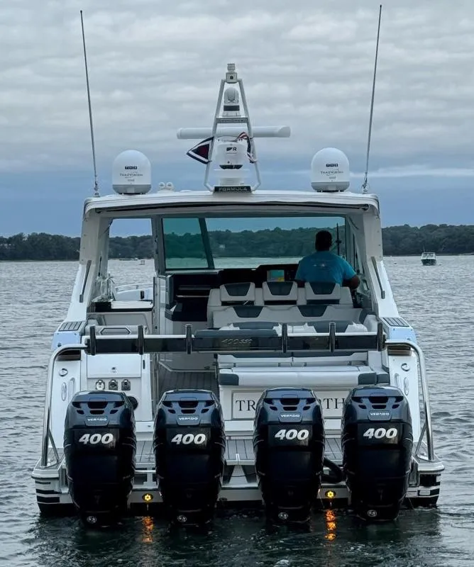 Slide: The Image of 2020 Formula 400 Super Sport Crossover boat with four powerful outboard engines on water. - 9