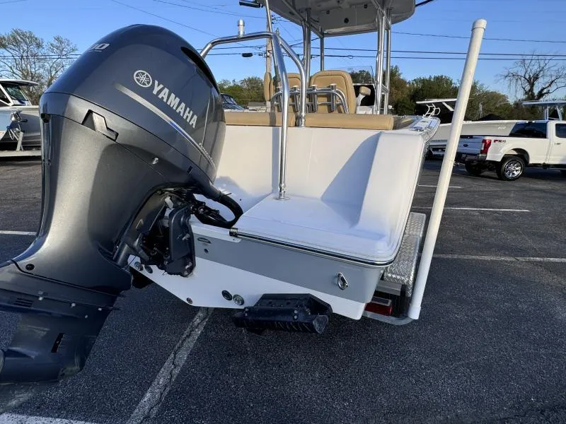 Slide: The Image of 2023 Sportsman 231 Heritage boat with Yamaha outboard motor in parking lot. - 14