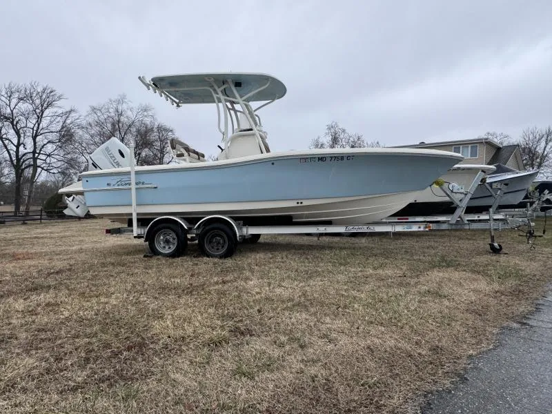 Slide: The Image of 2021 Pioneer 220 Bay Sport boat on trailer, parked on grass. - 3
