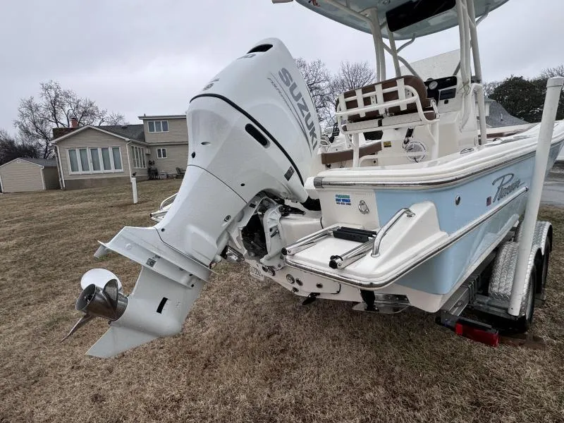 Slide: The Image of 2021 Pioneer 220 Bay Sport boat with Suzuki outboard motor on a trailer. - 5