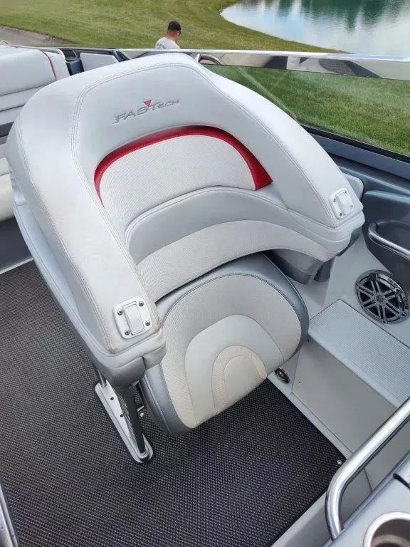 Slide: The Image of 2015 Formula 382 FASTech boat seat with sleek design and red accents. - 11