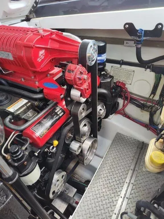 Slide: The Image of Engine compartment of a 2015 Formula 382 FASTech boat, featuring a red supercharger. - 13