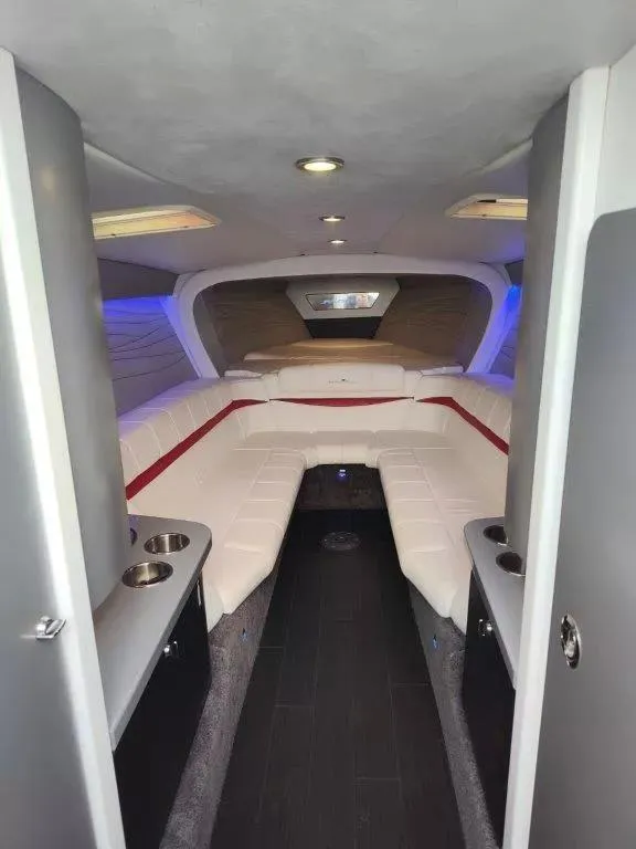 Slide: The Image of Luxurious interior of a 2015 Formula 382 FASTech boat with plush seating and modern design. - 16