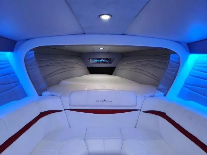 Slide: The Image of Interior of 2015 Formula 382 FASTech boat with blue ambient lighting and white seating. - 19
