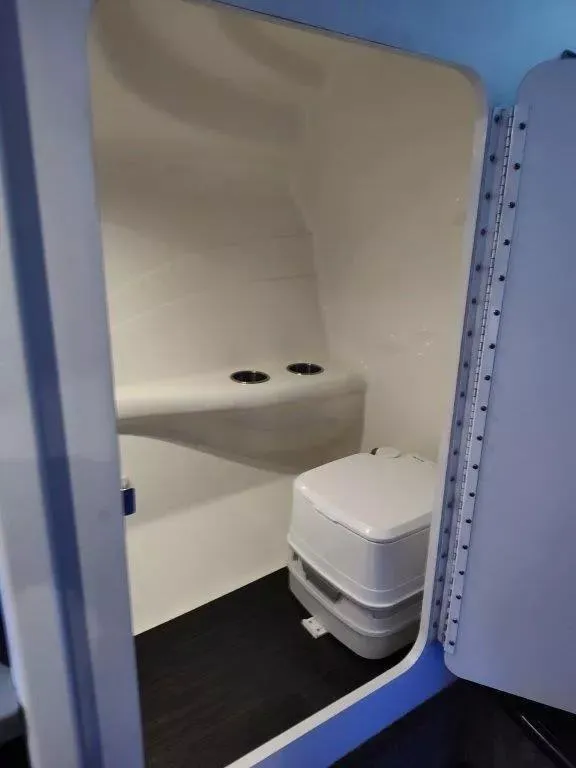 Slide: The Image of Interior of a 2015 Formula 382 FASTech boat bathroom with compact toilet. - 20