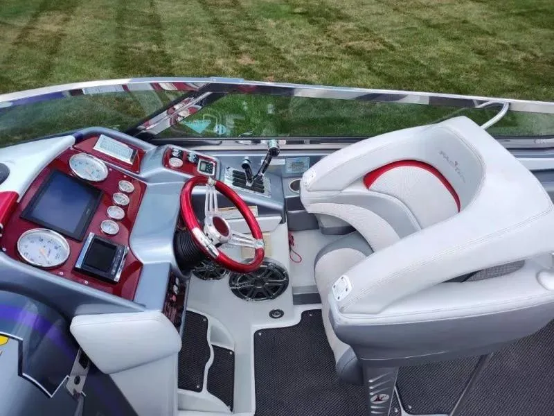 Slide: The Image of 2015 Formula 382 FASTech boat cockpit with red accents and modern controls. - 9