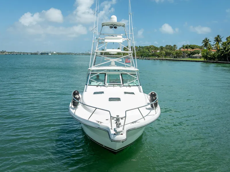 Slide: The Image of 2006 Tiara Yachts 4200 Open on calm water, clear sky, palm trees in background. - 16