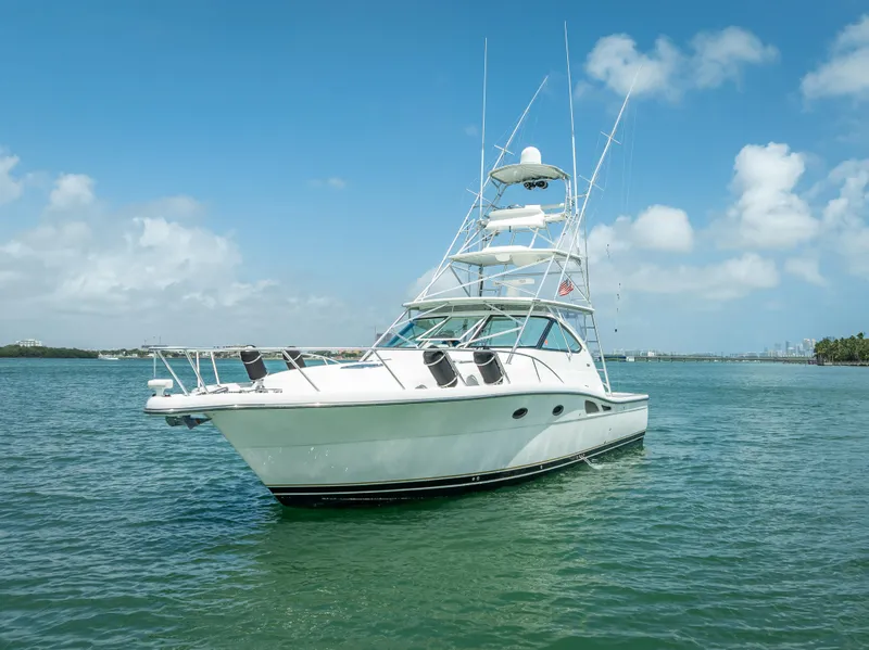Slide: The Image of 2006 Tiara Yachts 4200 Open on calm water under blue sky. - 19