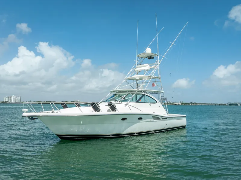 Slide: The Image of 2006 Tiara Yachts 4200 Open on calm water under a clear blue sky. - 21