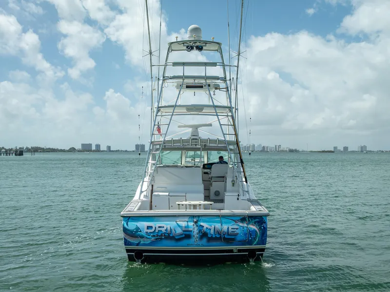 Slide: The Image of 2006 Tiara Yachts 4200 Open on water, rear view, clear sky. - 24