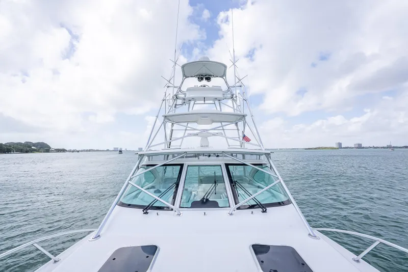 Slide: The Image of 2006 Tiara Yachts 4200 Open on calm waters under a cloudy sky. - 28