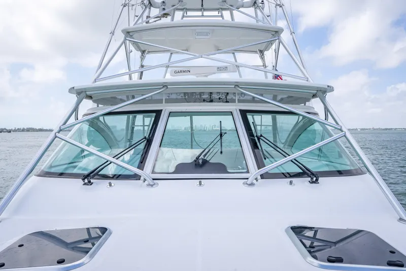 Slide: The Image of 2006 Tiara Yachts 4200 Open, front view, on calm water under a cloudy sky. - 29