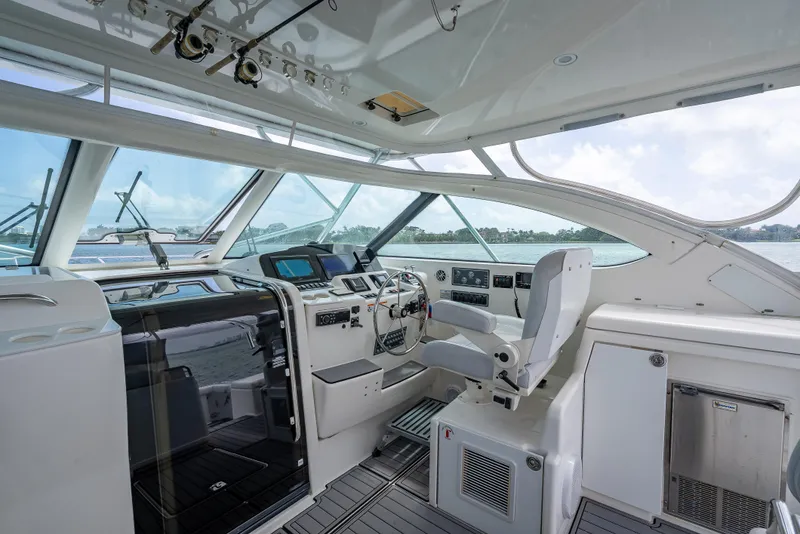 Slide: The Image of 2006 Tiara Yachts 4200 Open helm with modern controls and panoramic windows. - 36