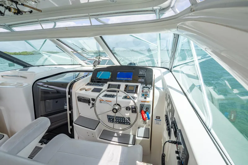 Slide: The Image of 2006 Tiara Yachts 4200 Open helm with modern navigation equipment and ocean view. - 37