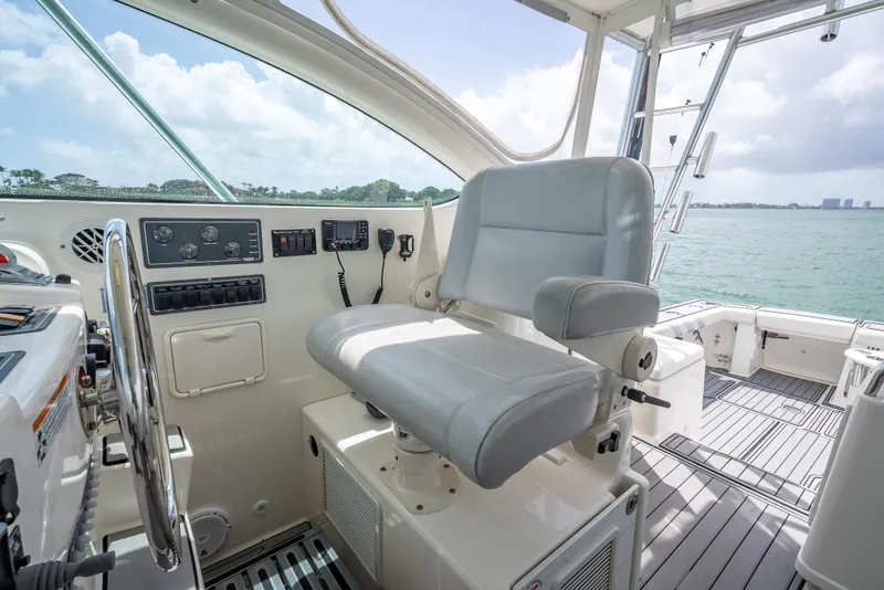 Slide: The Image of Captain's chair on 2006 Tiara Yachts 4200 Open, overlooking serene waters. - 40