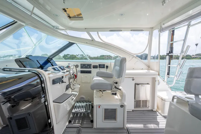 Slide: The Image of 2006 Tiara Yachts 4200 Open helm with modern controls and panoramic views. - 43