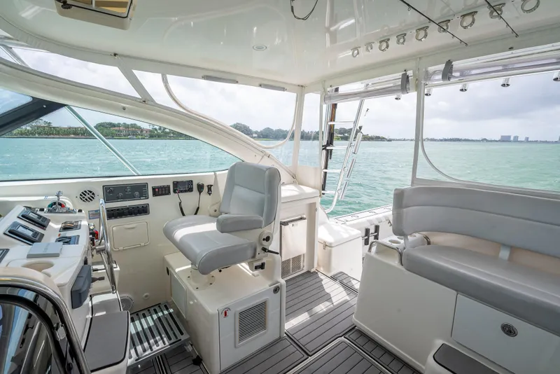 Slide: The Image of 2006 Tiara Yachts 4200 Open interior with helm, seating, and ocean view. - 44