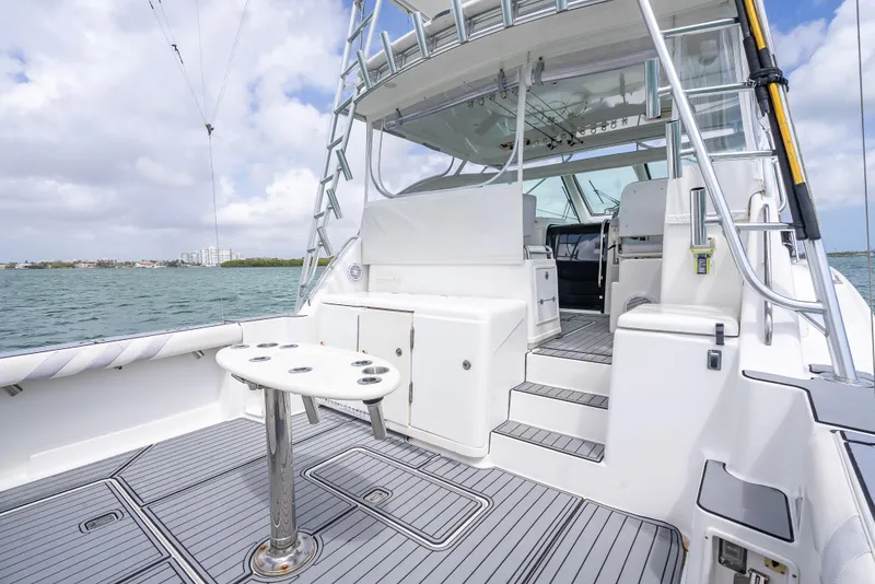 Slide: The Image of 2006 Tiara Yachts 4200 Open, spacious deck with seating, table, and ocean view. - 47