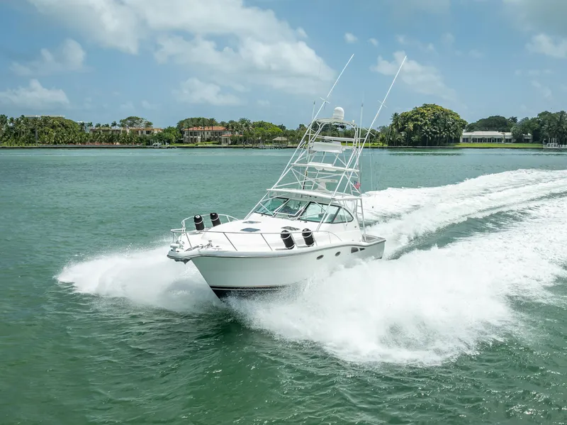 Slide: The Image of 2006 Tiara Yachts 4200 Open cruising on a sunny day in calm waters. - 6