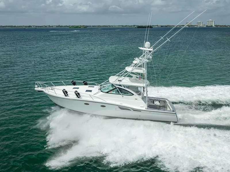 Slide: The Image of 2006 Tiara Yachts 4200 Open cruising on open water, showcasing sleek design and performance. - 8