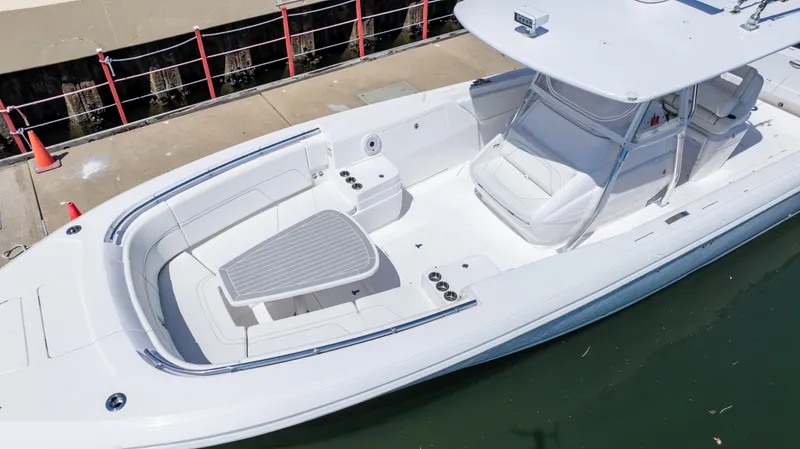 Slide: The Image of 2023 Intrepid 375 Nomad FE boat with spacious seating and sleek design. - 13