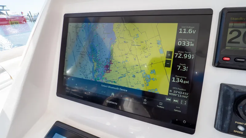 Slide: The Image of Garmin navigation display on 2023 Intrepid 375 Nomad FE boat dashboard. - 15