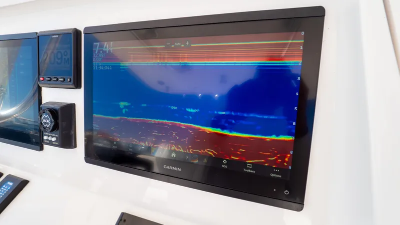 Slide: The Image of Control panel of 2023 Intrepid 375 Nomad FE with Garmin display. - 17