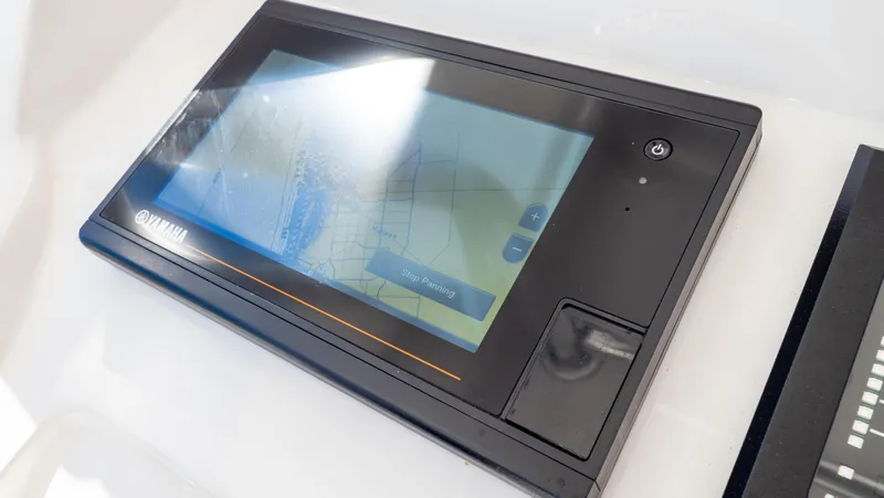 Slide: The Image of Touchscreen control panel on 2023 Intrepid 375 Nomad FE boat. - 19