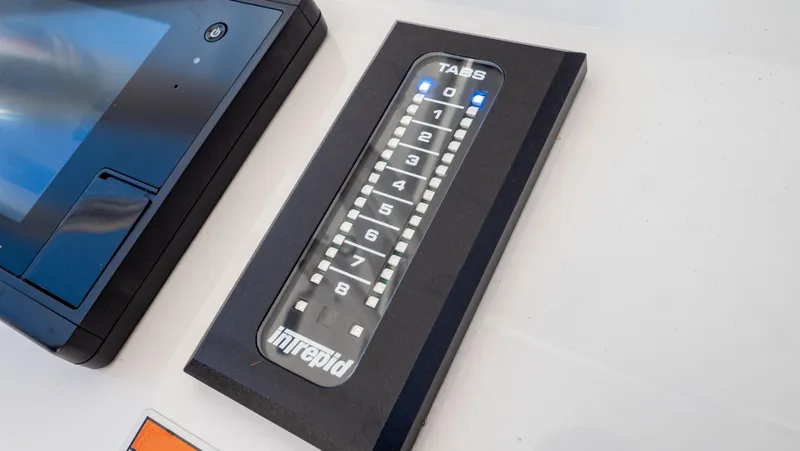 Slide: The Image of Control panel of 2023 Intrepid 375 Nomad FE boat with digital display and buttons. - 20