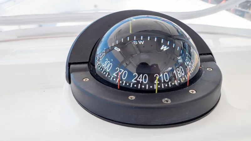 Slide: The Image of Compass on 2023 Intrepid 375 Nomad FE boat dashboard, showing navigation directions. - 21