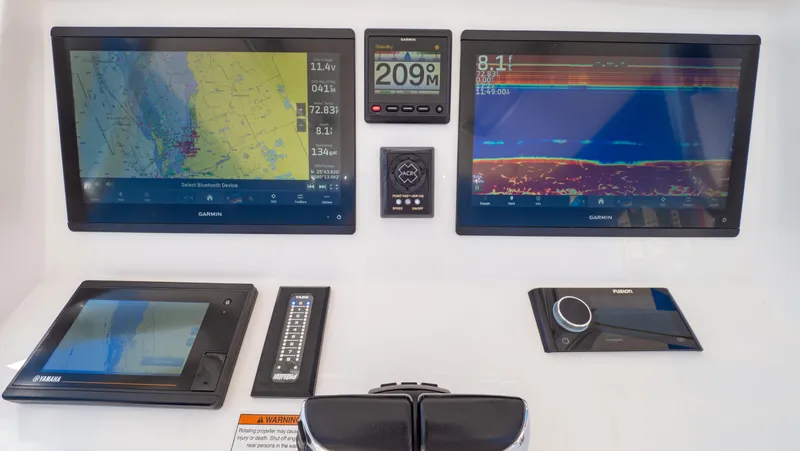 Slide: The Image of 2023 Intrepid 375 Nomad FE dashboard with navigation and control screens. - 25