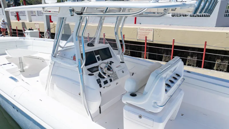 Slide: The Image of 2023 Intrepid 375 Nomad FE boat with sleek console and seating. - 29