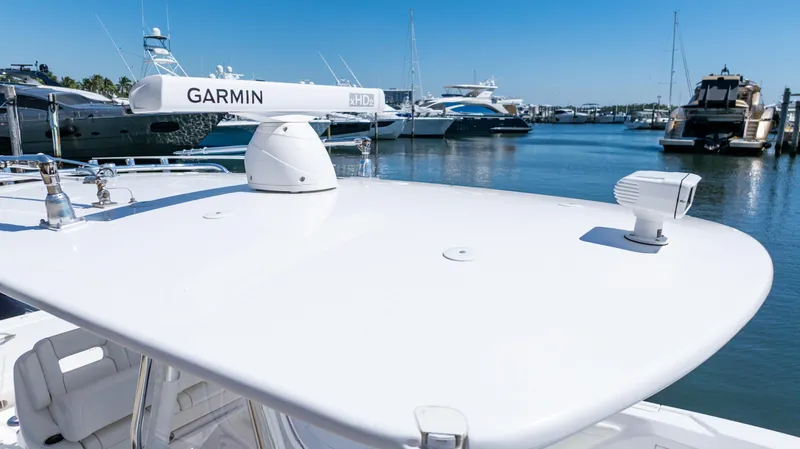 Slide: The Image of 2023 Intrepid 375 Nomad FE with Garmin radar, docked in a marina. - 31