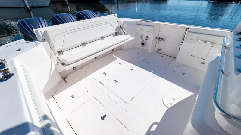Slide: The Image of 2023 Intrepid 375 Nomad FE boat interior with spacious seating and storage. - 32