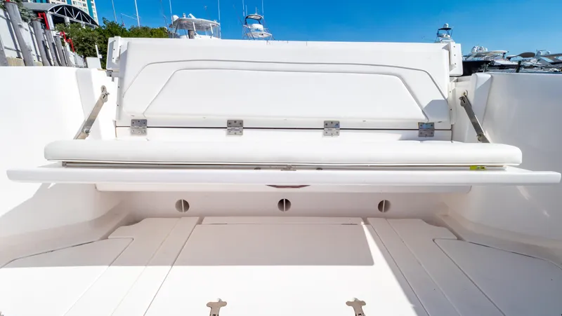 Slide: The Image of 2023 Intrepid 375 Nomad FE boat with foldable seating in the cockpit area. - 33