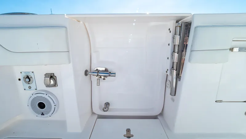 Slide: The Image of 2023 Intrepid 375 Nomad FE boat interior with shower and speaker system. - 37