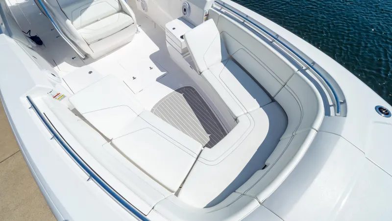 Slide: The Image of 2023 Intrepid 375 Nomad FE boat with spacious white seating area. - 4