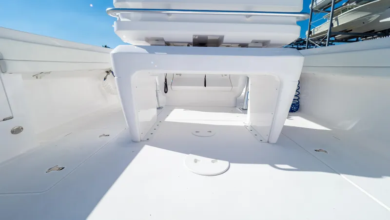 Slide: The Image of 2023 Intrepid 375 Nomad FE boat interior with spacious deck and seating area. - 42