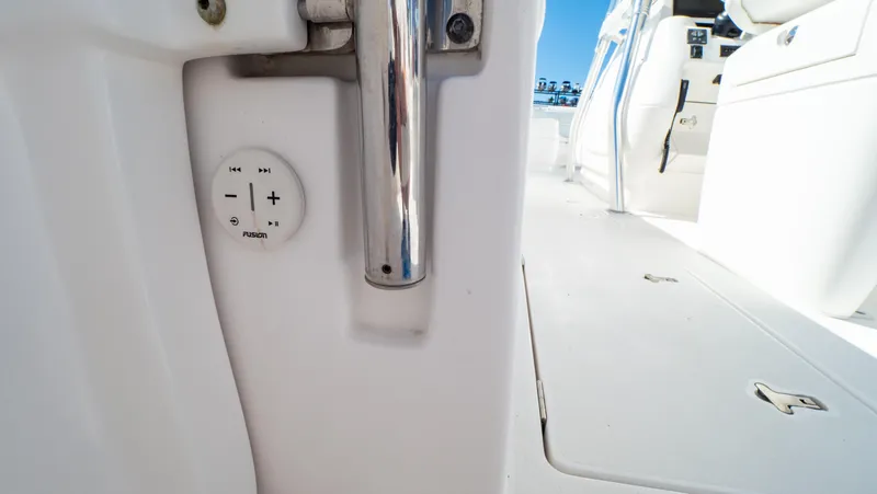 Slide: The Image of 2023 Intrepid 375 Nomad FE boat interior with control panel and sleek design. - 49