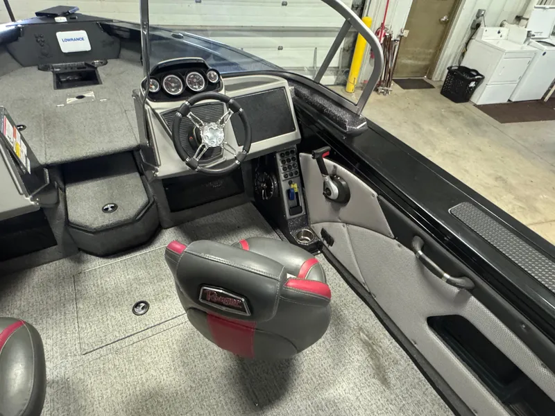 Slide: The Image of 2021 Ranger VX1888 WT boat interior with steering wheel and dashboard controls. - 12