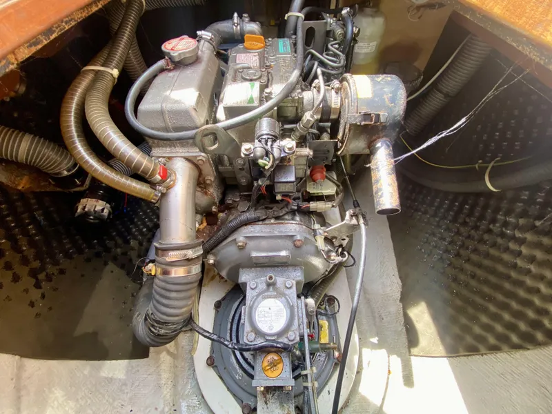 Slide: The Image of Engine compartment of a 2007 Lagoon 380 S2 sailboat, showing detailed mechanical components. - 28
