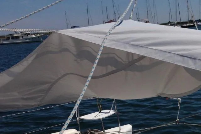 Slide: The Image of Sailboat with sunshade on water, Lagoon 380 S2, 2007 model. - 29