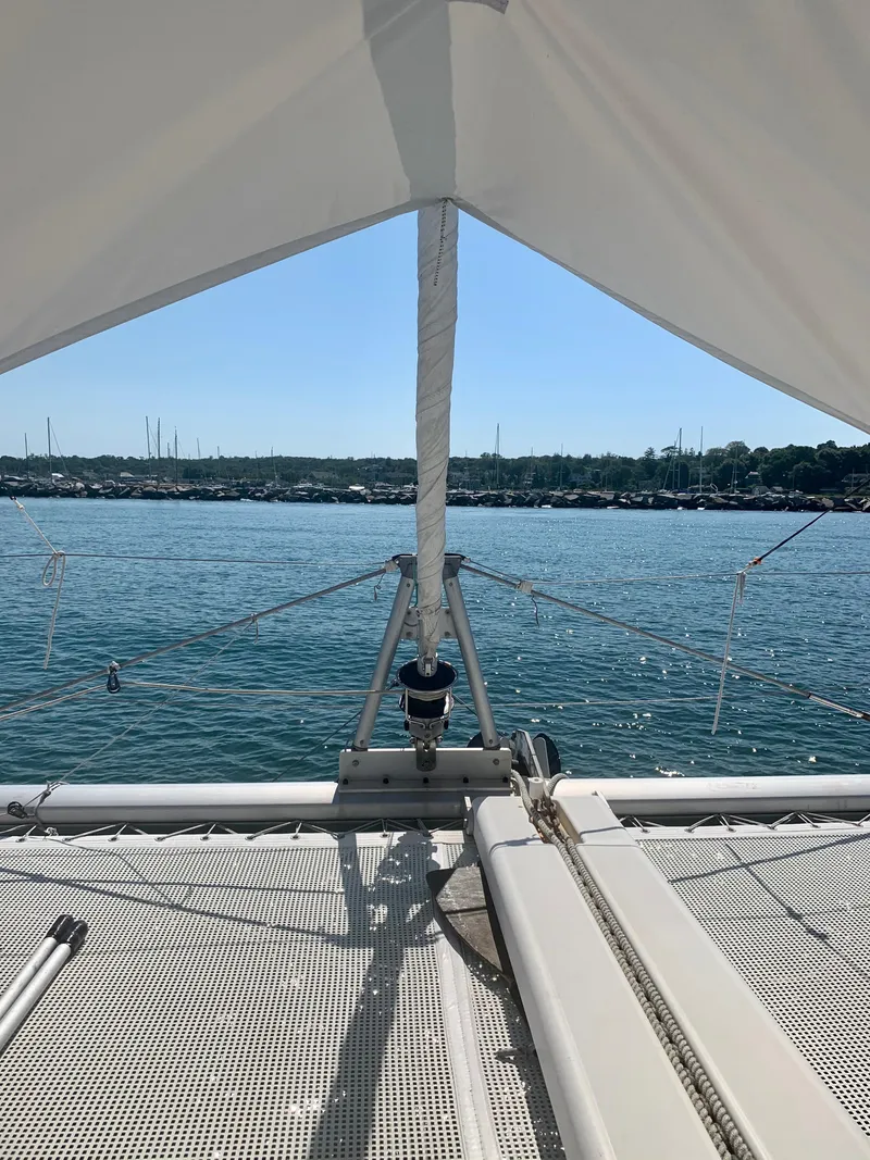 Slide: The Image of 2007 Lagoon 380 S2 catamaran on calm water with clear sky. - 30