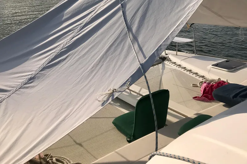 Slide: The Image of 2007 Lagoon 380 S2 catamaran deck with sunshade and seating. - 31