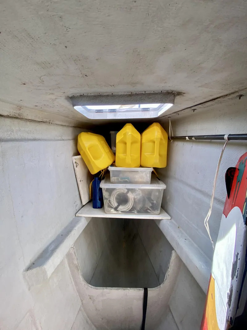 Slide: The Image of Interior storage space of a 2007 Lagoon 380 S2 catamaran with yellow containers. - 37