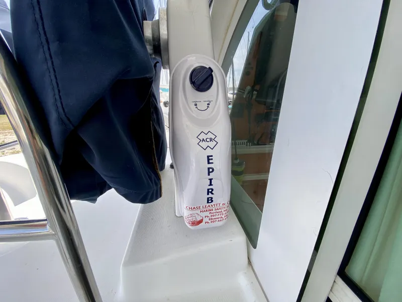 Slide: The Image of EPIRB device on 2007 Lagoon 380 S2 yacht, mounted near window. - 39