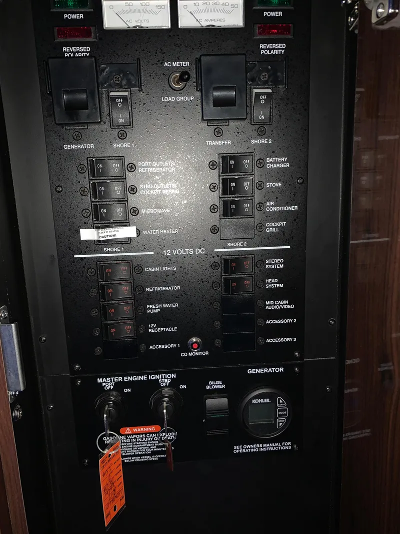 Slide: The Image of Electrical control panel of a 2017 Sea Ray Sundancer 310 boat. - 12