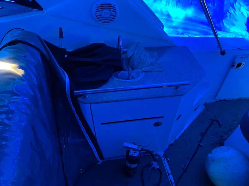 Slide: The Image of 2017 Sea Ray Sundancer 310 interior with countertop and blue lighting. - 5